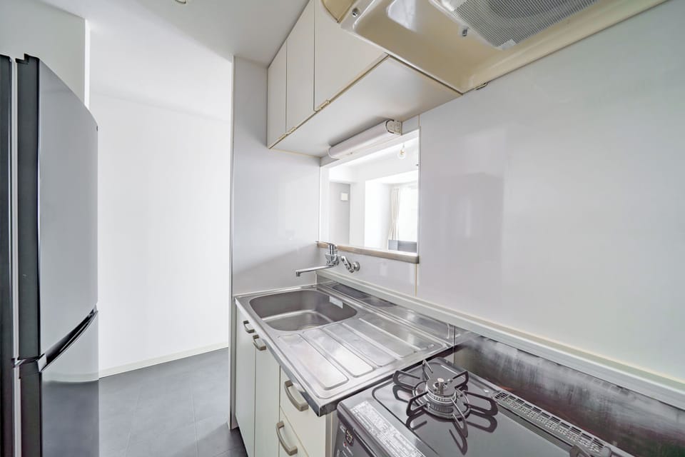 Apartment | Private kitchen | Fridge, microwave, stovetop, cookware/dishes/utensils