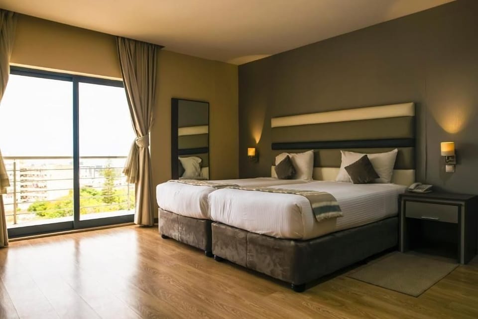 Deluxe Twin Room, Balcony, City View | In-room safe, desk, laptop workspace, soundproofing