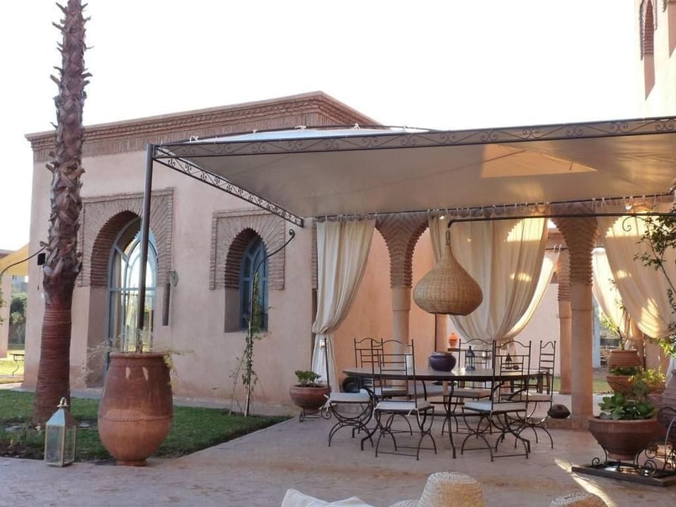 Villa, Balcony, Garden View | Outdoor dining
