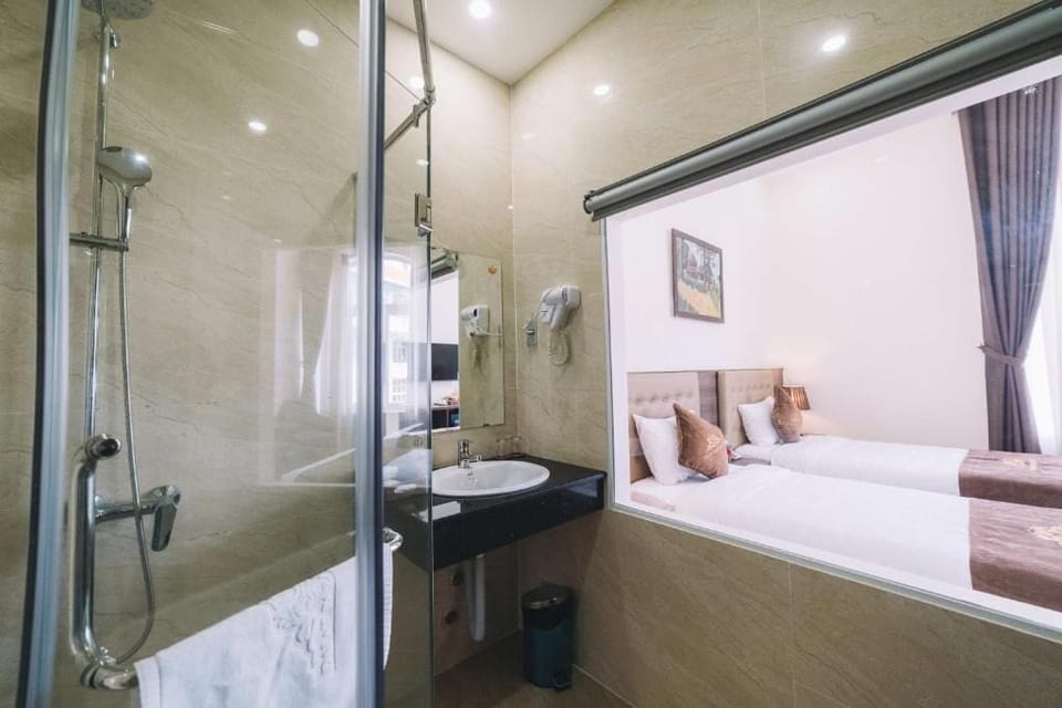 Deluxe Double or Twin Room, Balcony, City View | Bathroom | Slippers