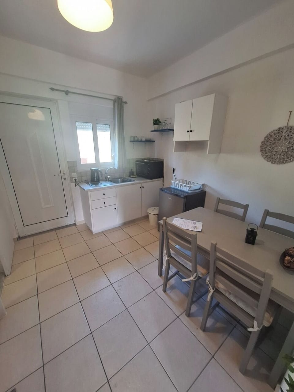 Standard Quadruple Room, City View | Private kitchen | Mini-fridge, oven, stovetop, cookware/dishes/utensils