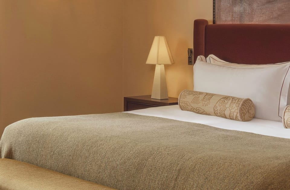 Premium bedding, memory foam beds, free minibar items, in-room safe