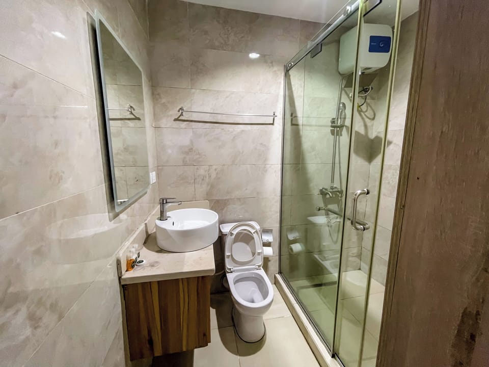 Shower, free toiletries, slippers, towels