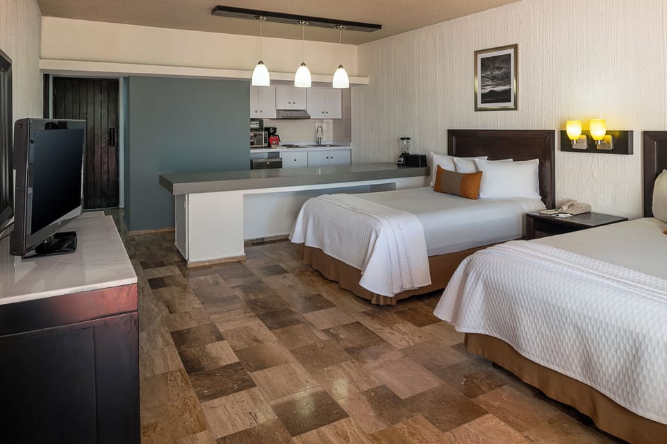 One Bedroom Suite | Down comforters, in-room safe, iron/ironing board, bed sheets