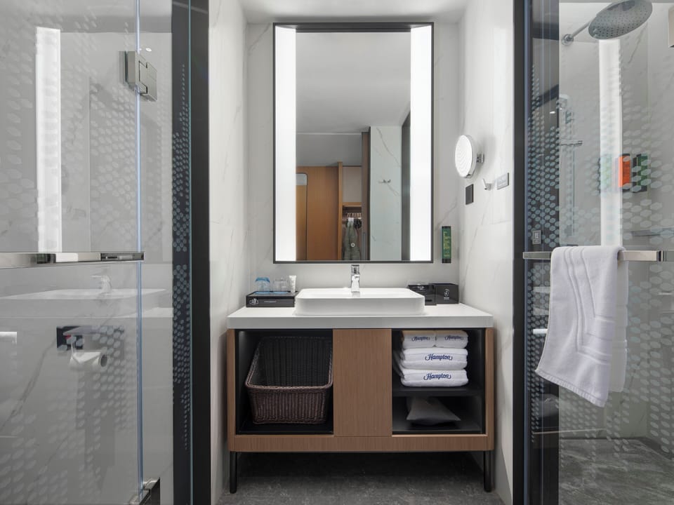 Shower, hair dryer, towels, shampoo