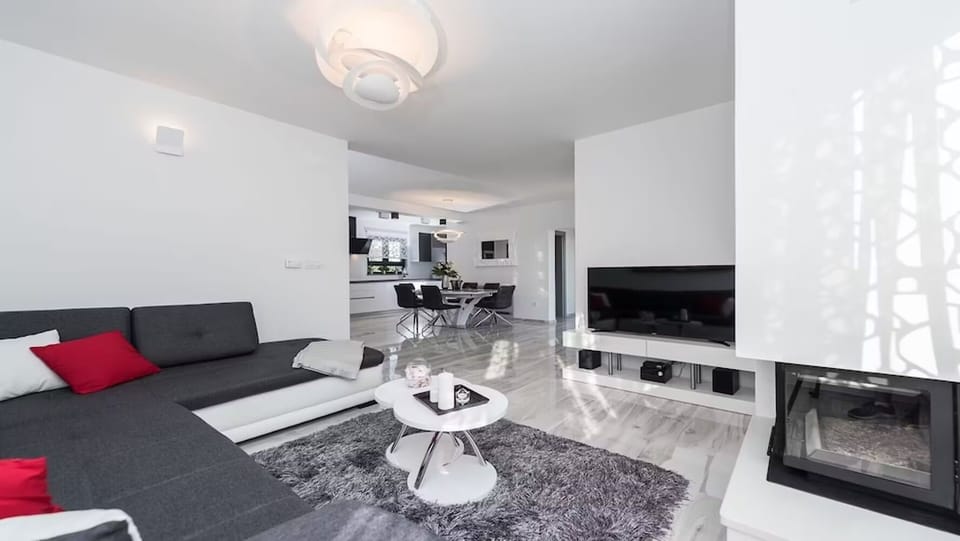 Luxury Villa, Partial Sea View | Living area | 100-cm LCD TV with satellite channels, fireplace