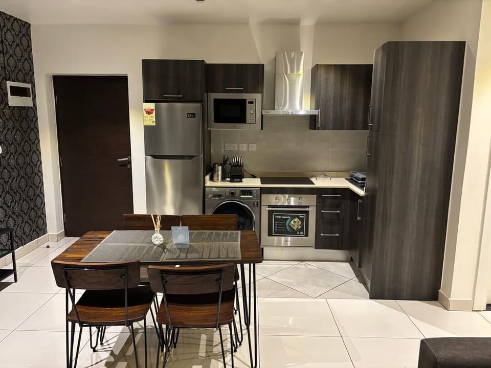 Deluxe Apartment, City View | Living area | Flat-screen TV