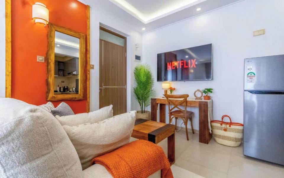 Superior Studio Suite | Living area | Flat-screen TV