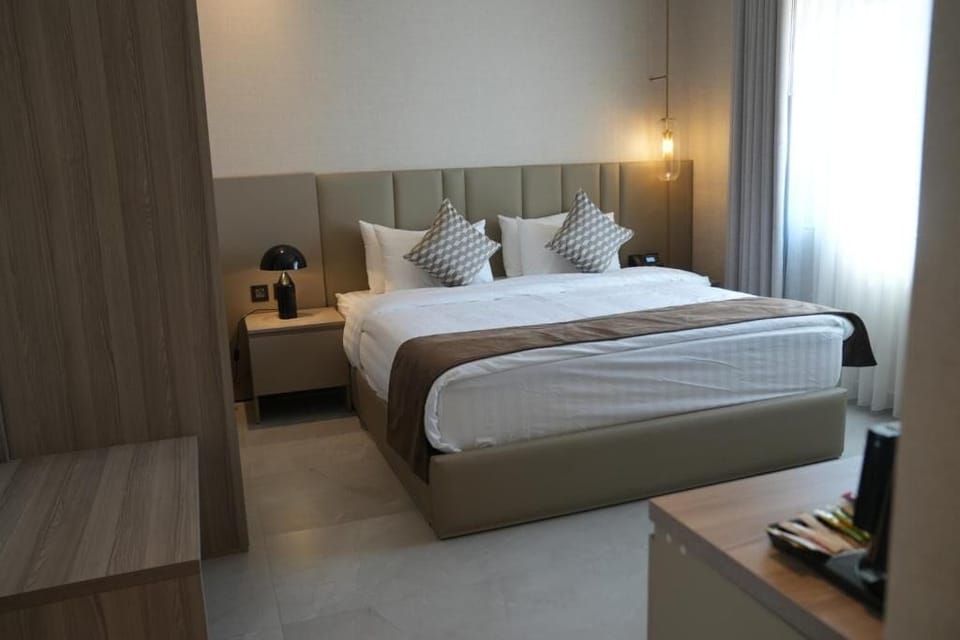 Family Studio Suite, City View | Minibar, in-room safe, desk, laptop workspace
