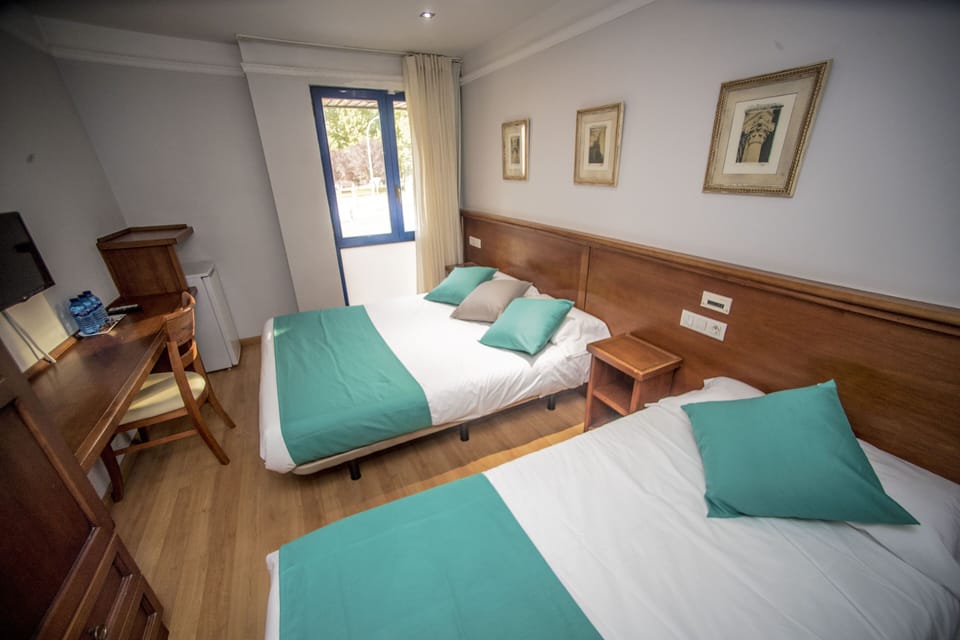 Triple Room | Premium bedding, down comforters, desk, blackout drapes