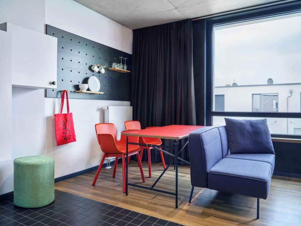 Design Studio, 1 King Bed | Living area | 30-inch flat-screen TV with cable channels
