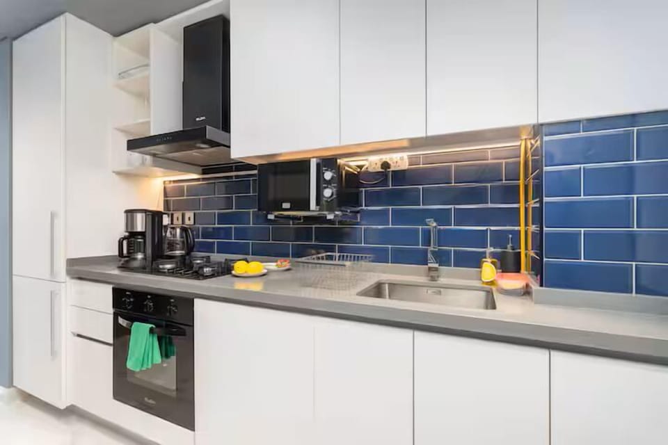 Luxury Studio, Balcony, City View | Private kitchen | Full-size fridge, microwave, oven, stovetop