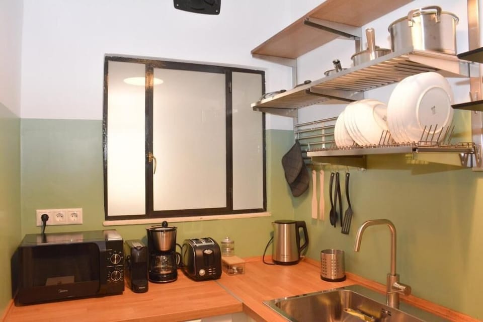 Apartment, 1 Bedroom | Private kitchen | Cleaning supplies, freezer