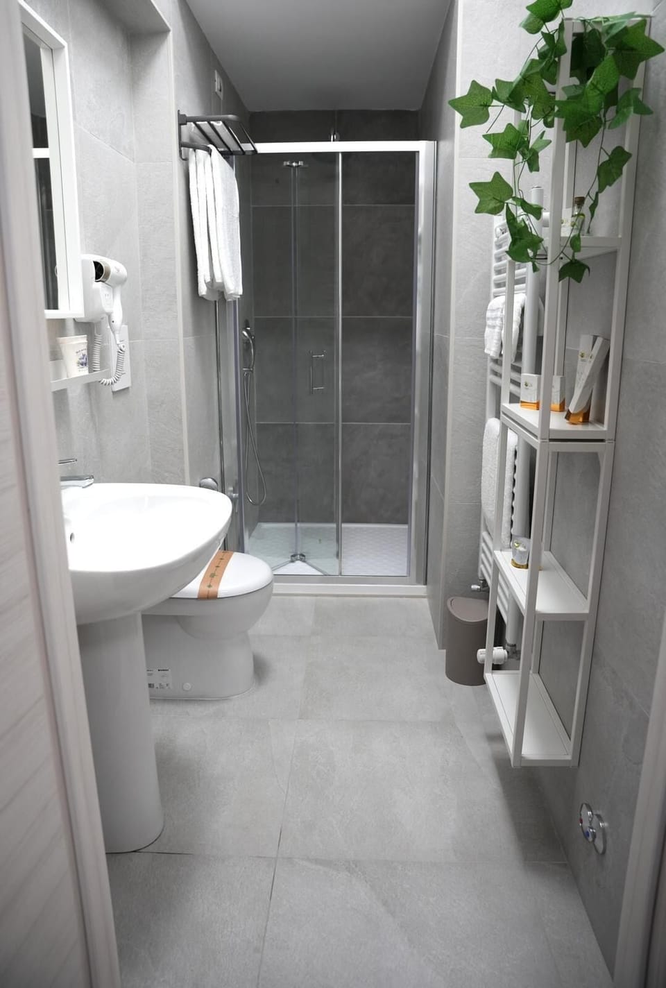 Shower, rainfall showerhead, hair dryer, towels