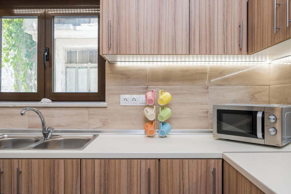 Apartment, Balcony, Sea View | Private kitchen | Full-size fridge, microwave, oven, stovetop