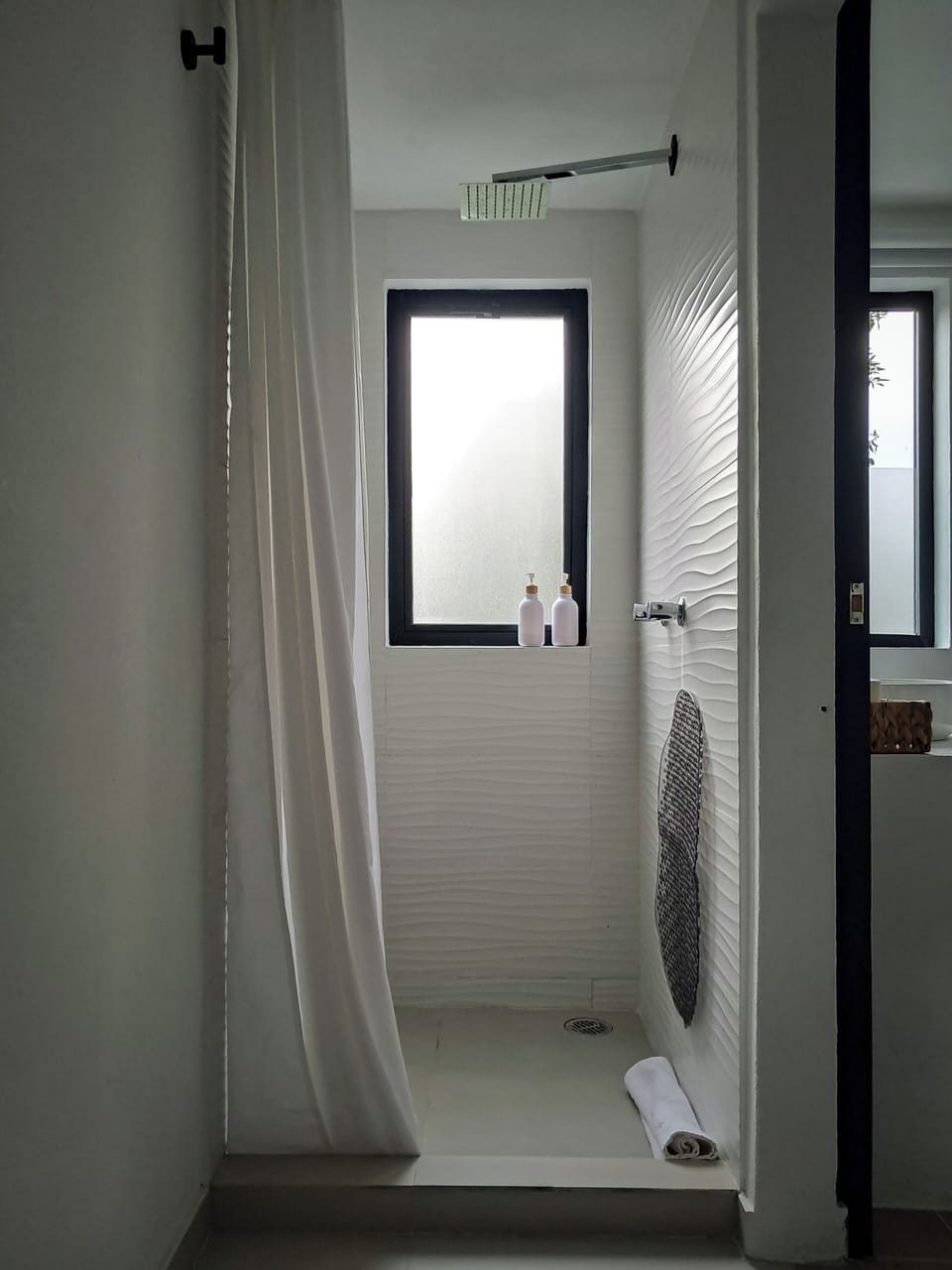 Deluxe Quadruple Room, Courtyard View | Bathroom | Shower, hair dryer (on request), towels, soap