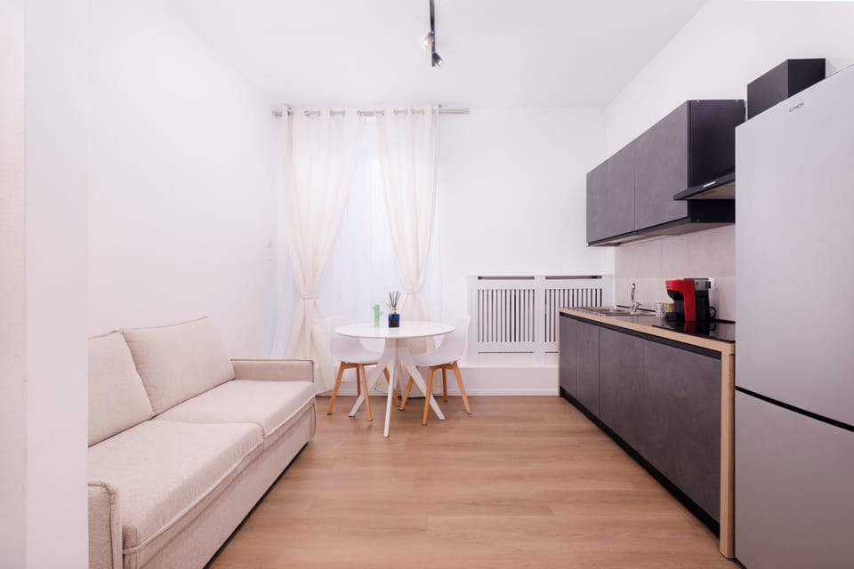 Deluxe Apartment, City View | Living area | TV