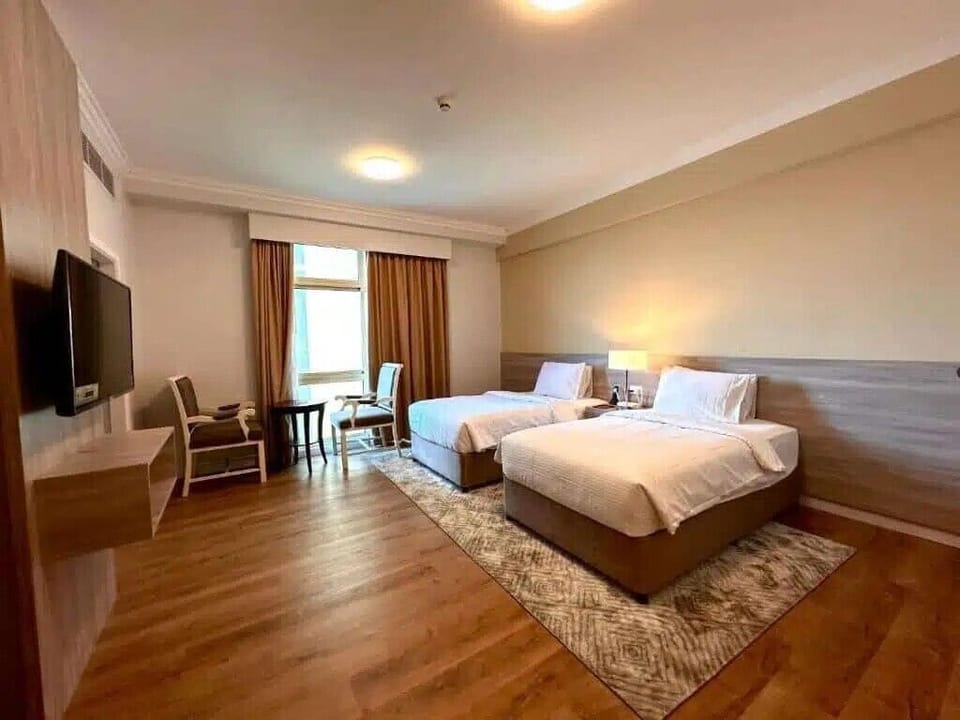 Standard Twin Room, City View | In-room safe, desk, laptop workspace, blackout drapes