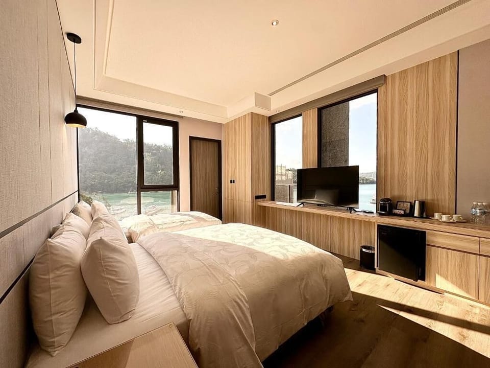 Deluxe Triple Room, Lake View | Desk, laptop workspace, soundproofing, free WiFi