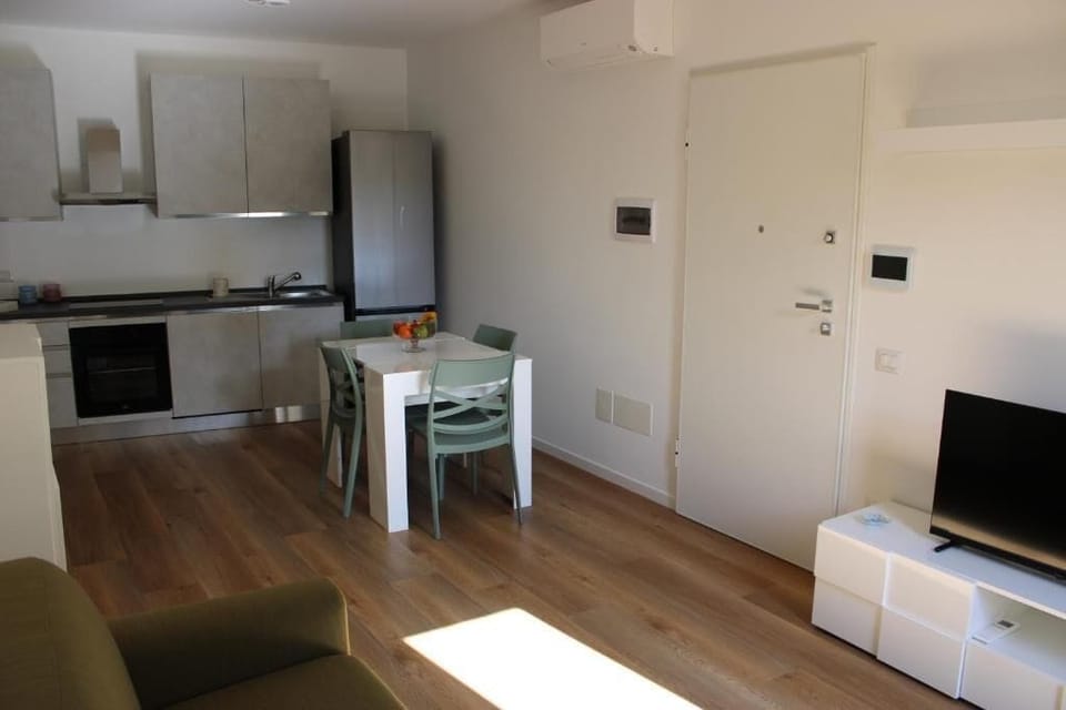 Apartment, Balcony, Courtyard View | Living area | 55-inch flat-screen TV with satellite channels, TV