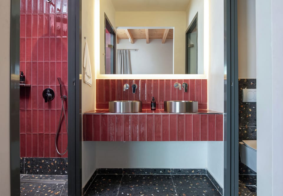 Suite, Balcony, City View | Bathroom | Combined shower/tub, hair dryer, slippers, towels