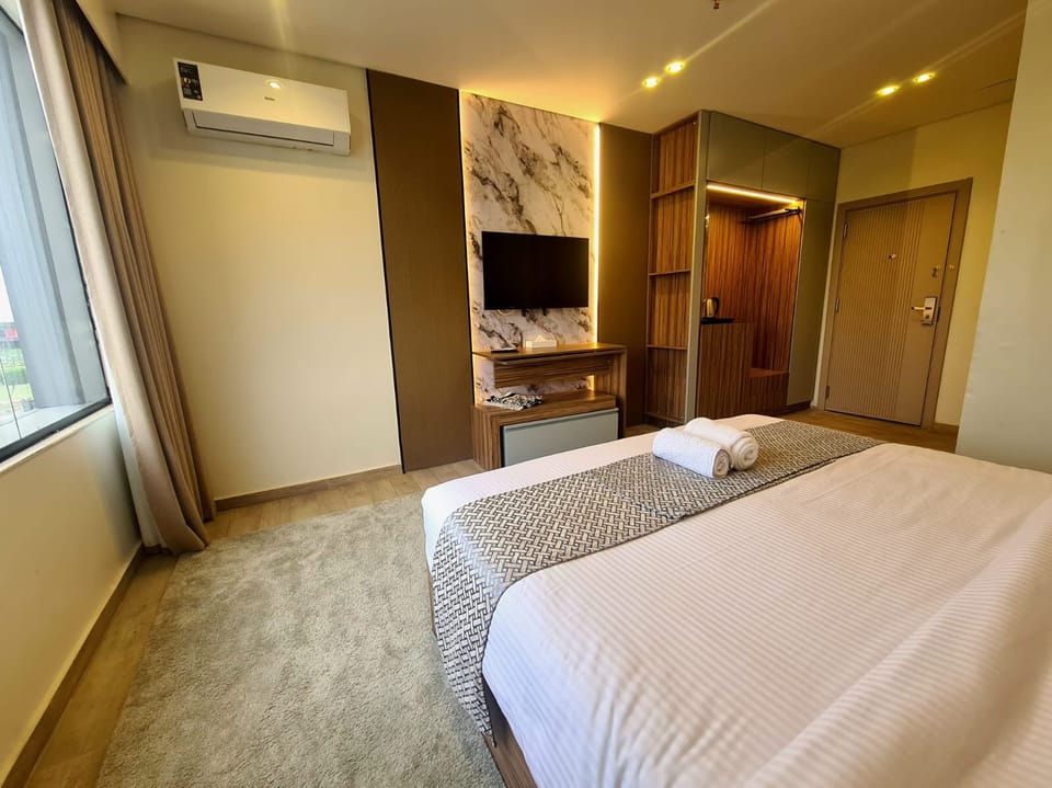 City Room | Premium bedding, memory foam beds, laptop workspace, blackout drapes