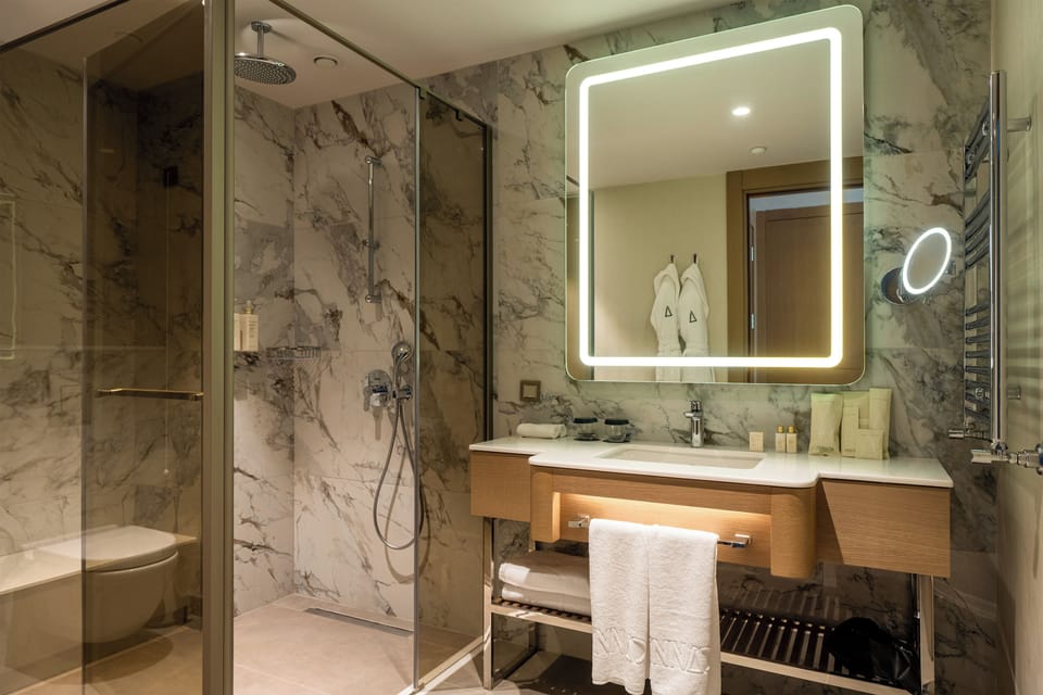 Executive Thermal Family Suite | Bathroom | Designer toiletries, hair dryer, bathrobes, slippers