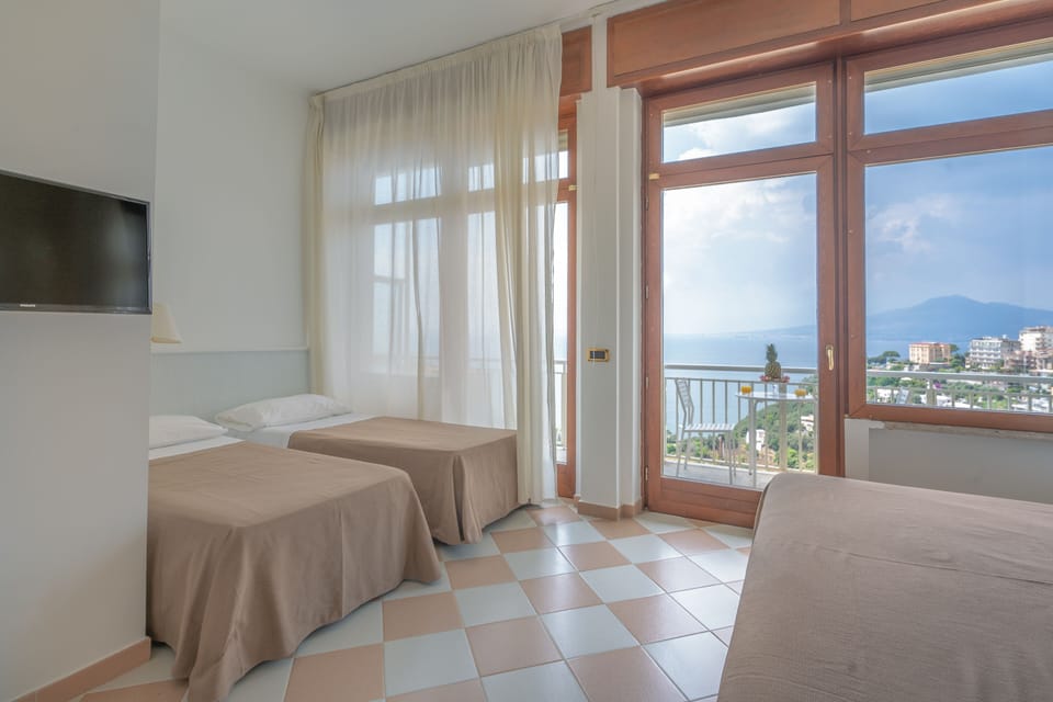 Superior Quadruple Room, Terrace, Sea View | 1 bedroom, minibar, in-room safe, desk