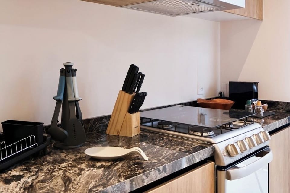 City Apartment, Balcony, City View | Private kitchen | Espresso maker, coffee/tea maker, electric kettle, dining tables