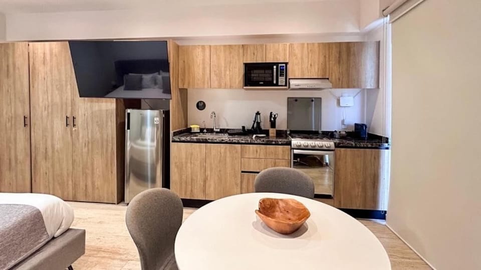 City Apartment, Balcony, City View | Private kitchen | Espresso maker, coffee/tea maker, electric kettle, dining tables