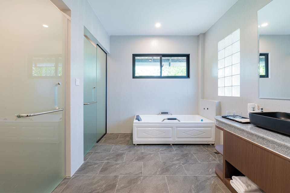 Family Triple Room, Pool View | Bathroom | Shower, hair dryer, bathrobes, slippers