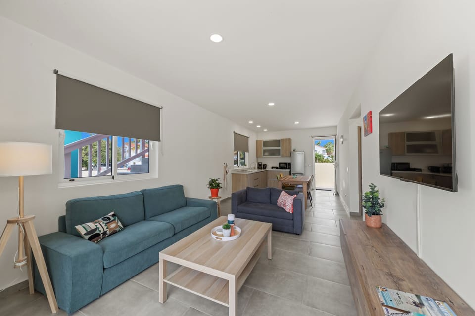 Apartment, Balcony, Park View | Living area | Flat-screen TV