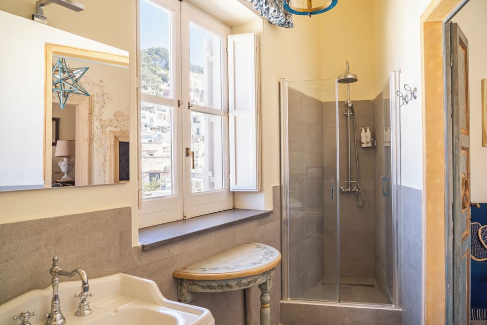 Deluxe Suite, City View | Bathroom | Shower, hair dryer, towels, soap