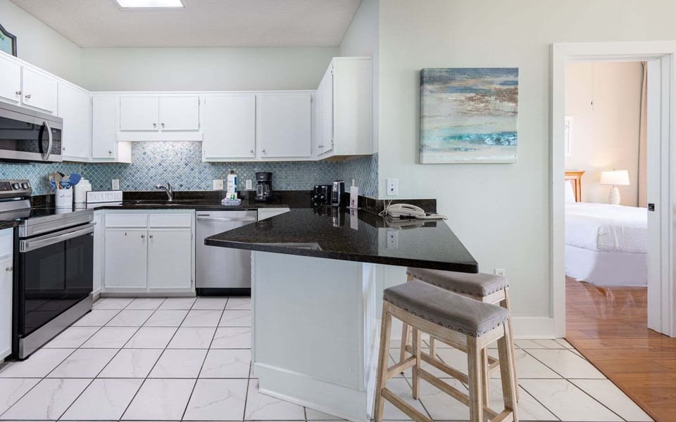 Condo, 2 Bedrooms | Private kitchen | Coffee/tea maker, fridge, oven, stovetop
