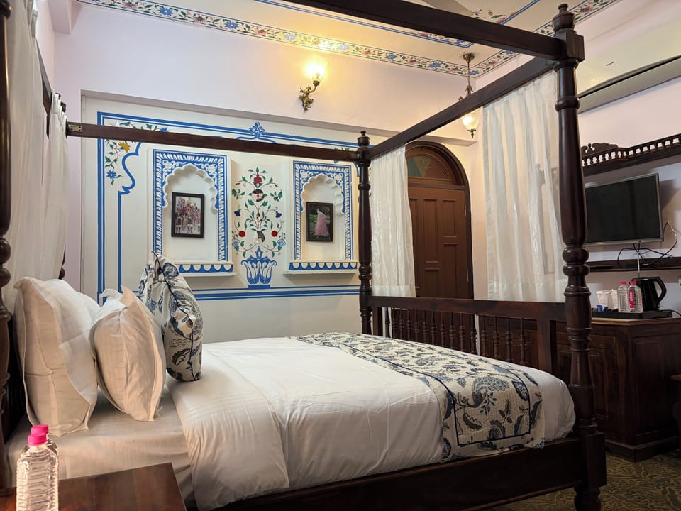 Luxury Suite, Garden View | In-room safe, desk, laptop workspace, iron/ironing board