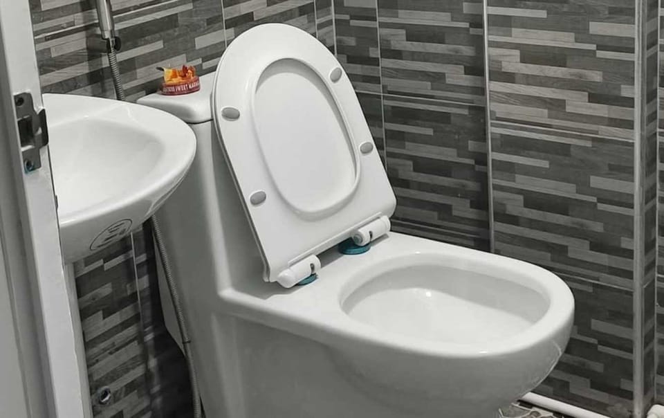 Shower, rainfall showerhead, towels, soap
