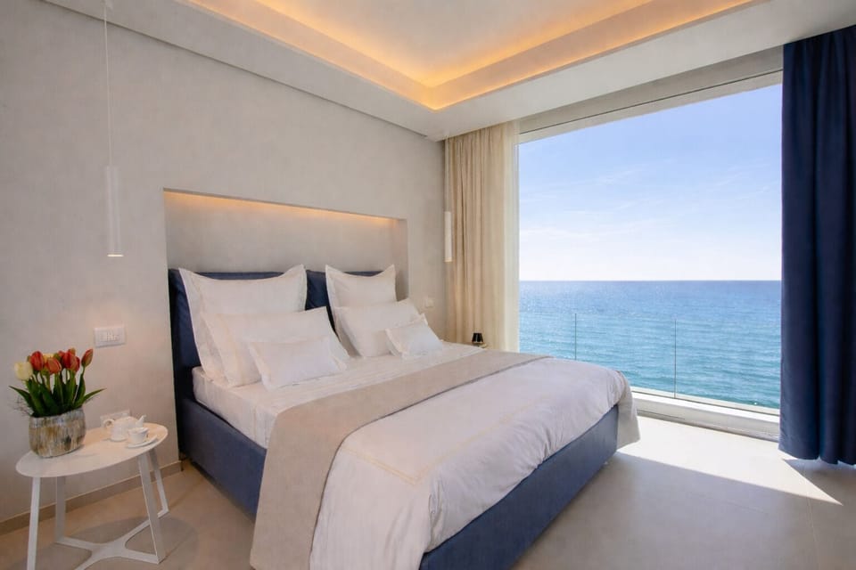 Deluxe Quadruple Room, 1 Queen Bed with Sofa bed, Non Smoking, Sea View | In-room safe, soundproofing, iron/ironing board, free WiFi