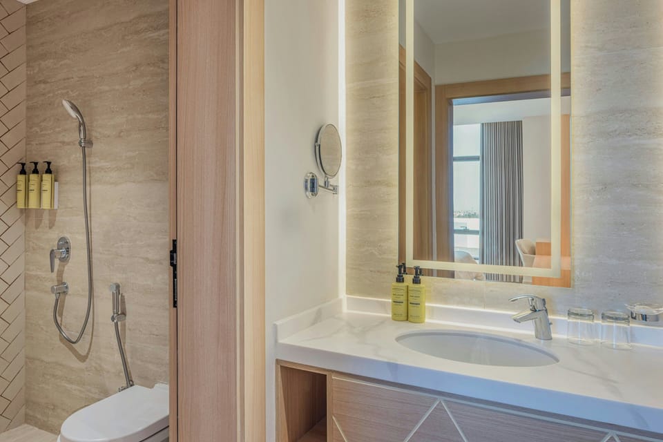 Shower, slippers, bidet, towels