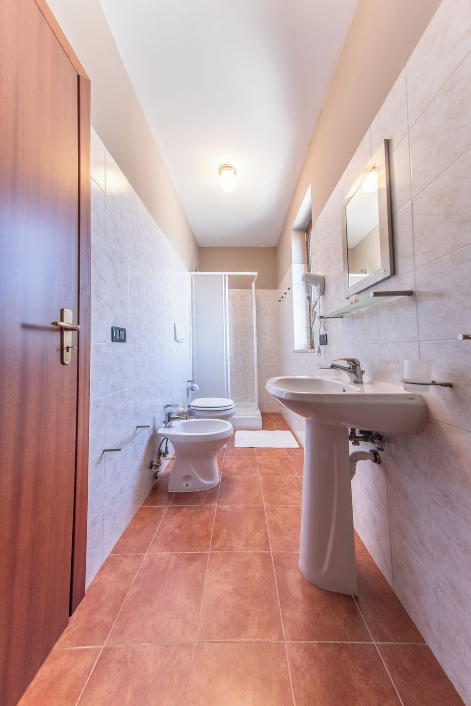 Quadruple Room | Bathroom | Shower, hair dryer, bidet, towels