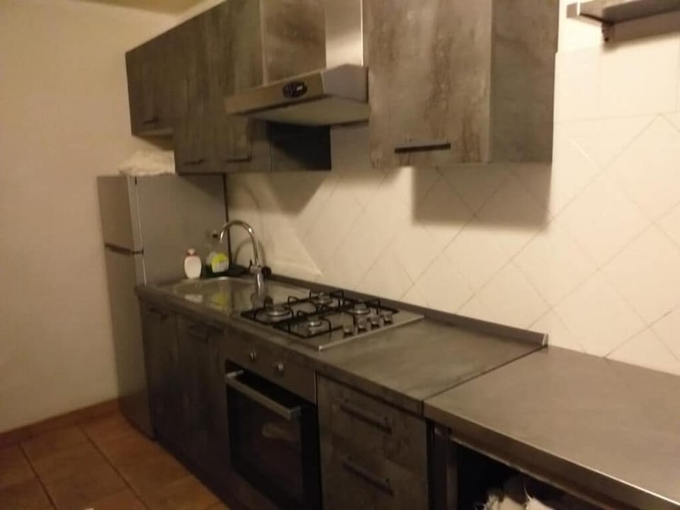 Full-size fridge, microwave, stovetop, cookware/dishes/utensils