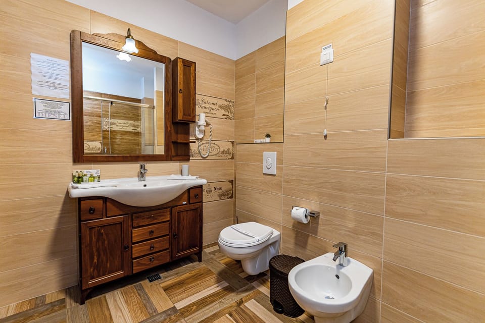 Suite, Balcony, Lake View | Bathroom | Slippers, towels, soap, shampoo