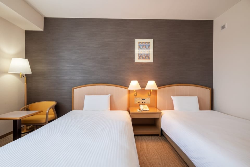 Twin Room, Non Smoking | Desk, laptop workspace, WiFi (free), bed sheets