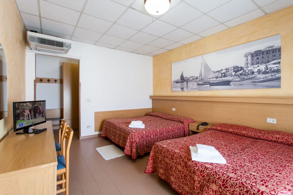 Standard Quadruple Room, 1 Bedroom | In-room safe, desk, free cribs/infant beds, free WiFi