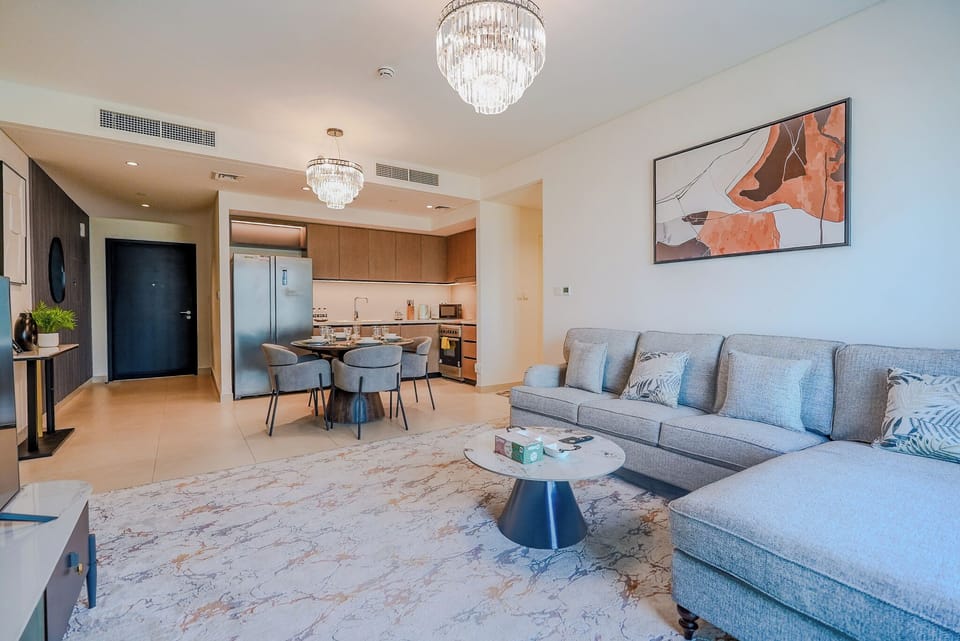 Deluxe Apartment, 2 Bedrooms, Balcony, City View | Living area | 55-inch Smart TV with digital channels