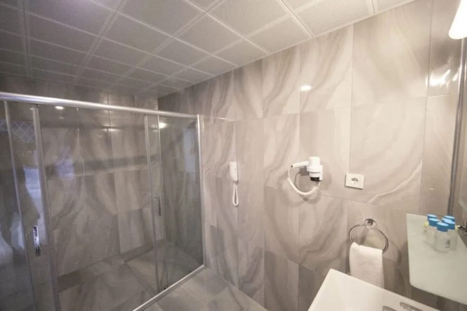 Shower, free toiletries, hair dryer, slippers