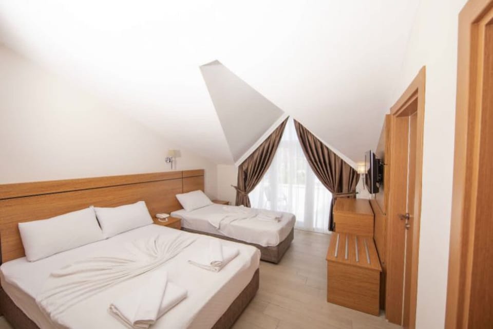 Standard Triple Room, Balcony | Premium bedding, minibar, in-room safe, laptop workspace
