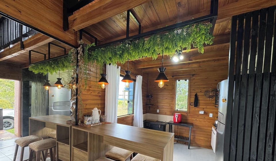 Deluxe Chalet, Jetted Tub, Mountain View | Private kitchen | Fridge, microwave, cookware/dishes/utensils, dining tables