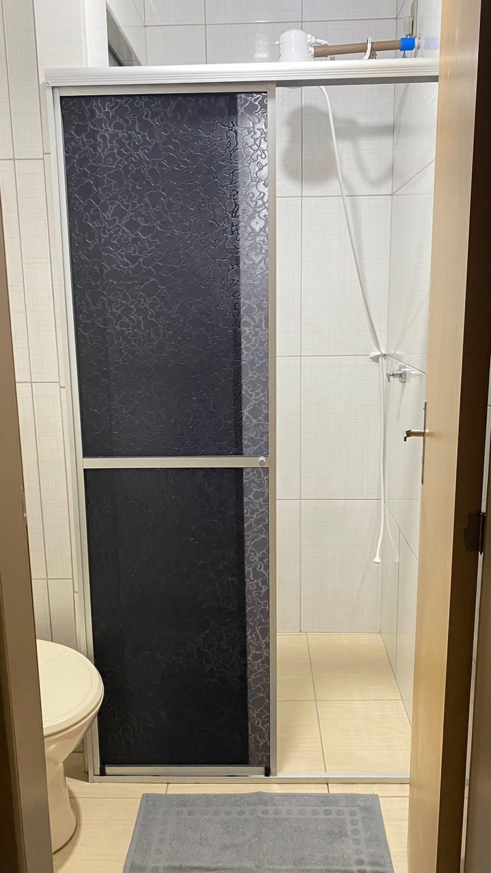 Basic Double Room, Balcony, City View | Bathroom | Shower, towels, soap, shampoo