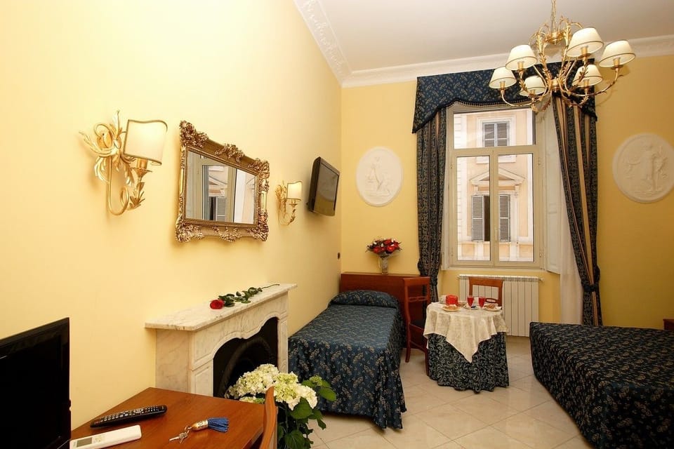 Triple Room | Minibar, in-room safe, desk, laptop workspace