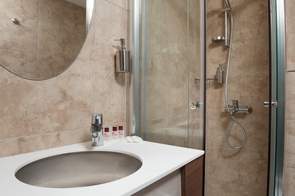 Shower, free toiletries, hair dryer, slippers